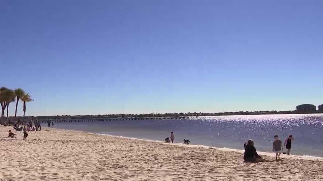 Cape Coral beachgoers embrace chilly weather as cold front hits Southwest Florida