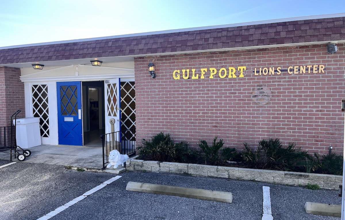 a brick building with a sign that read 