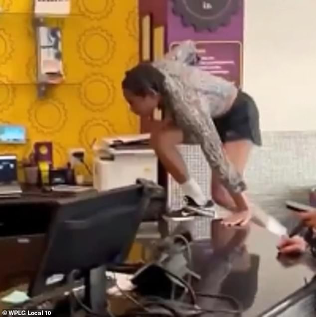 When the worker asked her to be quiet, Bryant allegedly became irate and climbed over the front desk counter and taunted him several times before she began hitting