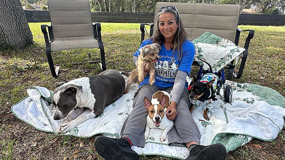 April McNeely with her animals at McNeely Farmily Rescue and Sanctuary (Spectrum News/Lizbeth Gutierrez)