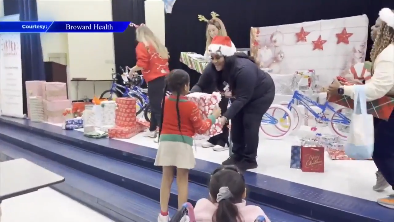 Nurses at Broward Health Medical Center help Santa deliver presents to elementary school students - WSVN 7News | Miami News, Weather, Sports
