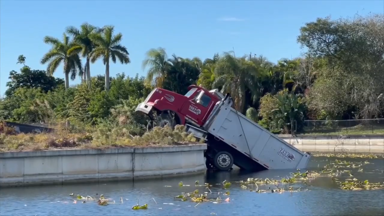 ‘You don’t see this every day’: Construction truck falls into Cape Coral canal - WSVN 7News | Miami News, Weather, Sports