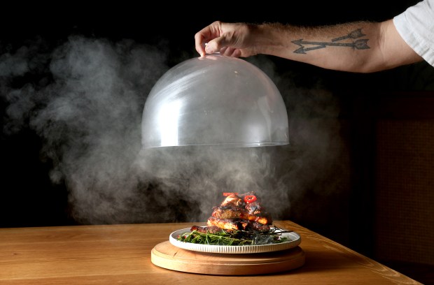 Chef Jeff McInnis unveils his Barbecued and Brûléed Smokey Ribs with brown sugar spiced, spicy pickled chilies, tangy rich barbecue sauce, and smoked rosemary at the Florida Room restaurant at The Fort pickleball complex in Snyder Park, Thursday, Nov. 20, 2025. (Mike Stocker/South Florida Sun Sentinel)