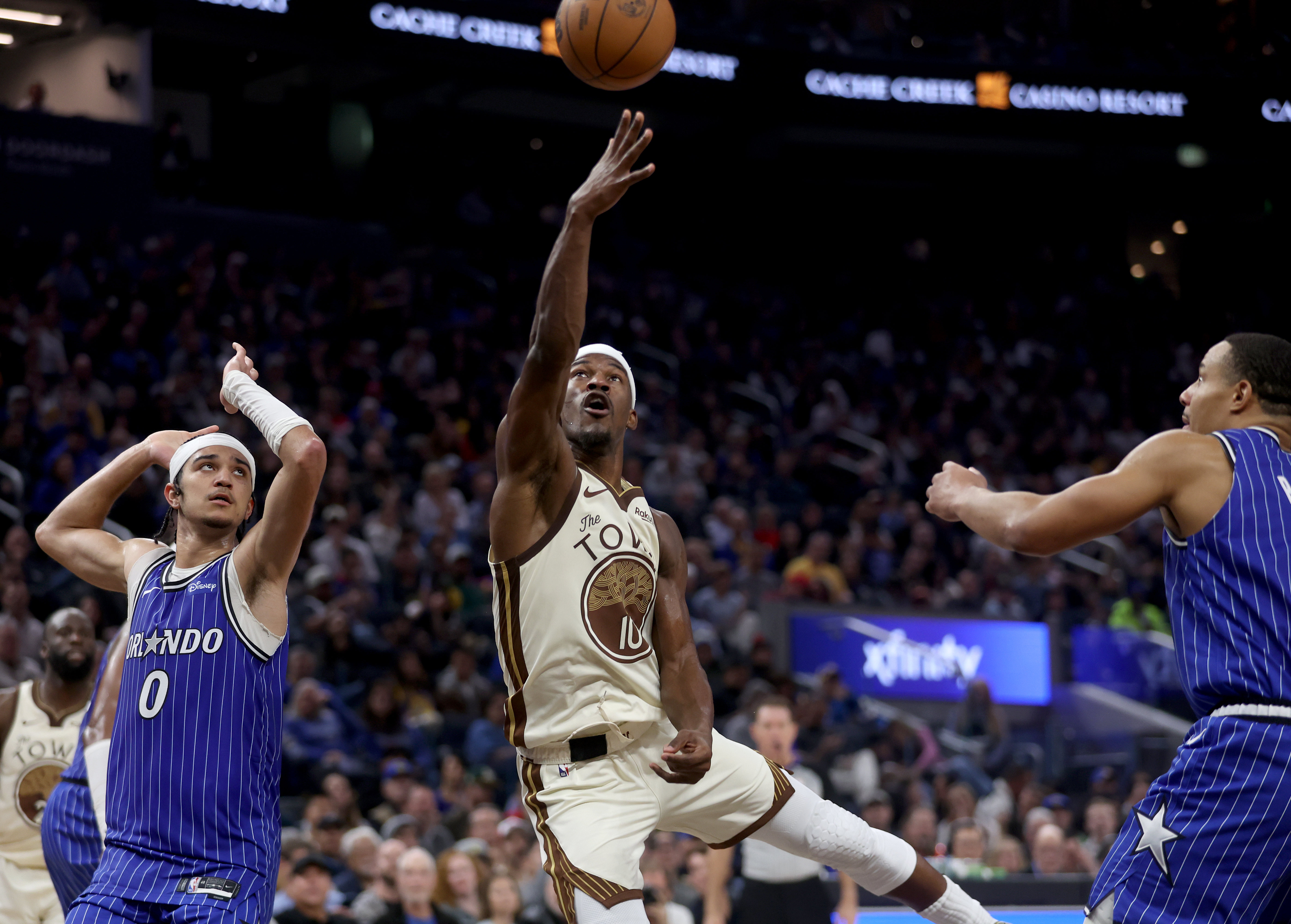 Golden State Warriors’ Jimmy Butler III #10 shoots a basket...