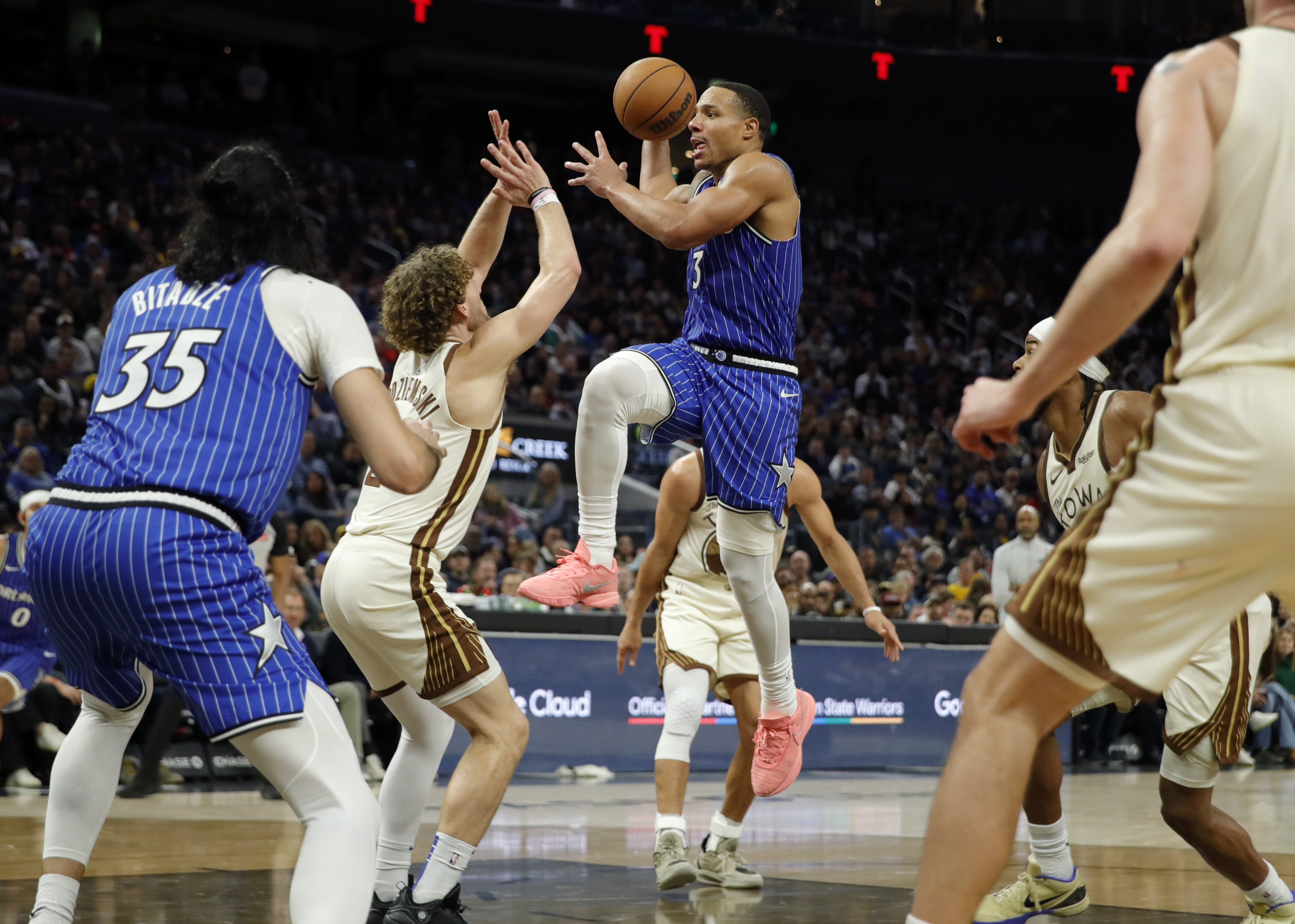 Orlando Magic’s Desmond Bane #3 drives to the basket as...