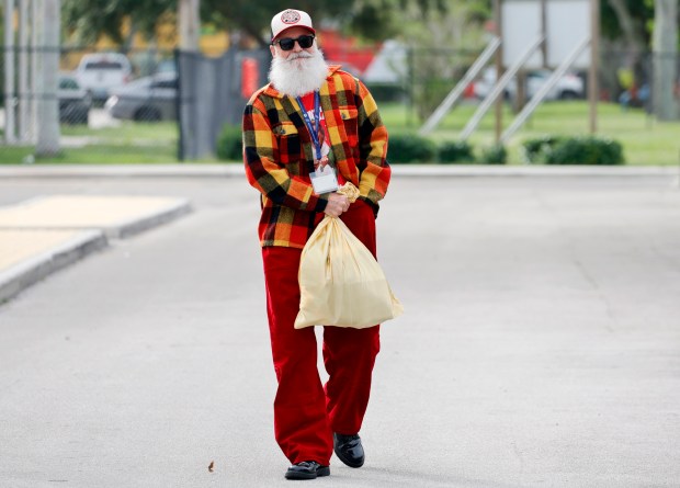 Sun Sentinel staff writer Ben Crandell arrives at Fort Lauderdale High School to make his first-ever appearance as Santa Claus on Monday, Dec. 15, 2025. Homeroom classes at St. Anthony Catholic School "adopted" students with special needs and donated holiday gifts delivered by Santa. (Amy Beth Bennett / South Florida Sun Sentinel)