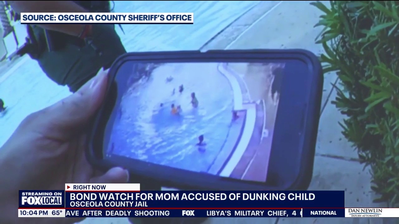 Surveillance video shows person pushing child underwater