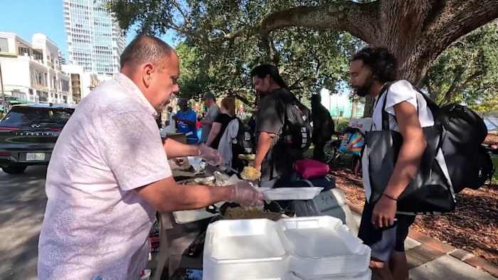‘I used to be out here:’ Volunteers spend Christmas feeding and clothing Orlando’s homeless