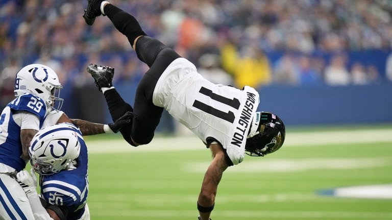 Jacksonville Jaguars wide receiver Parker Washington (11) catches a pass...