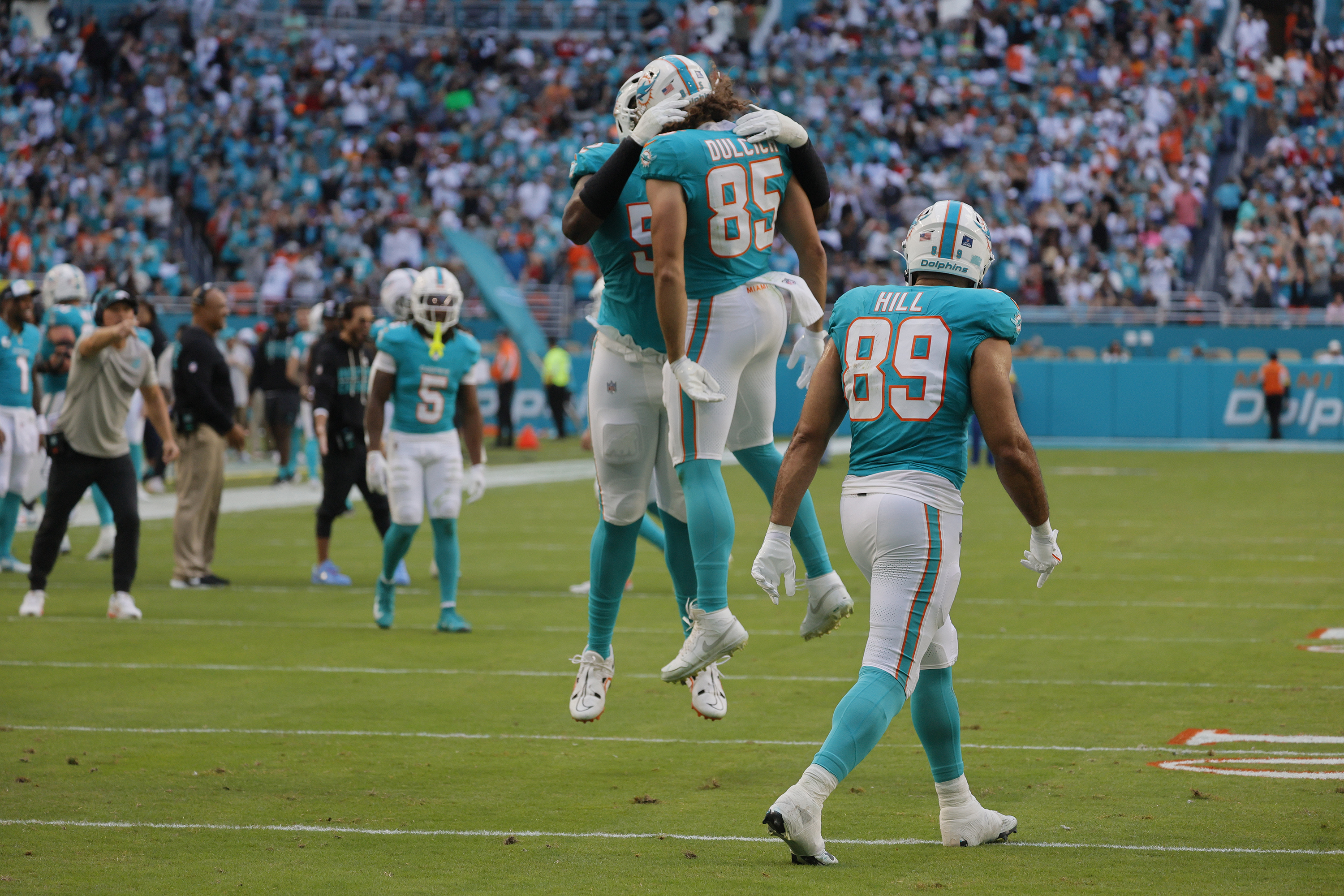 Miami Dolphins tight end Greg Dulcich celebrates a touchdown against...