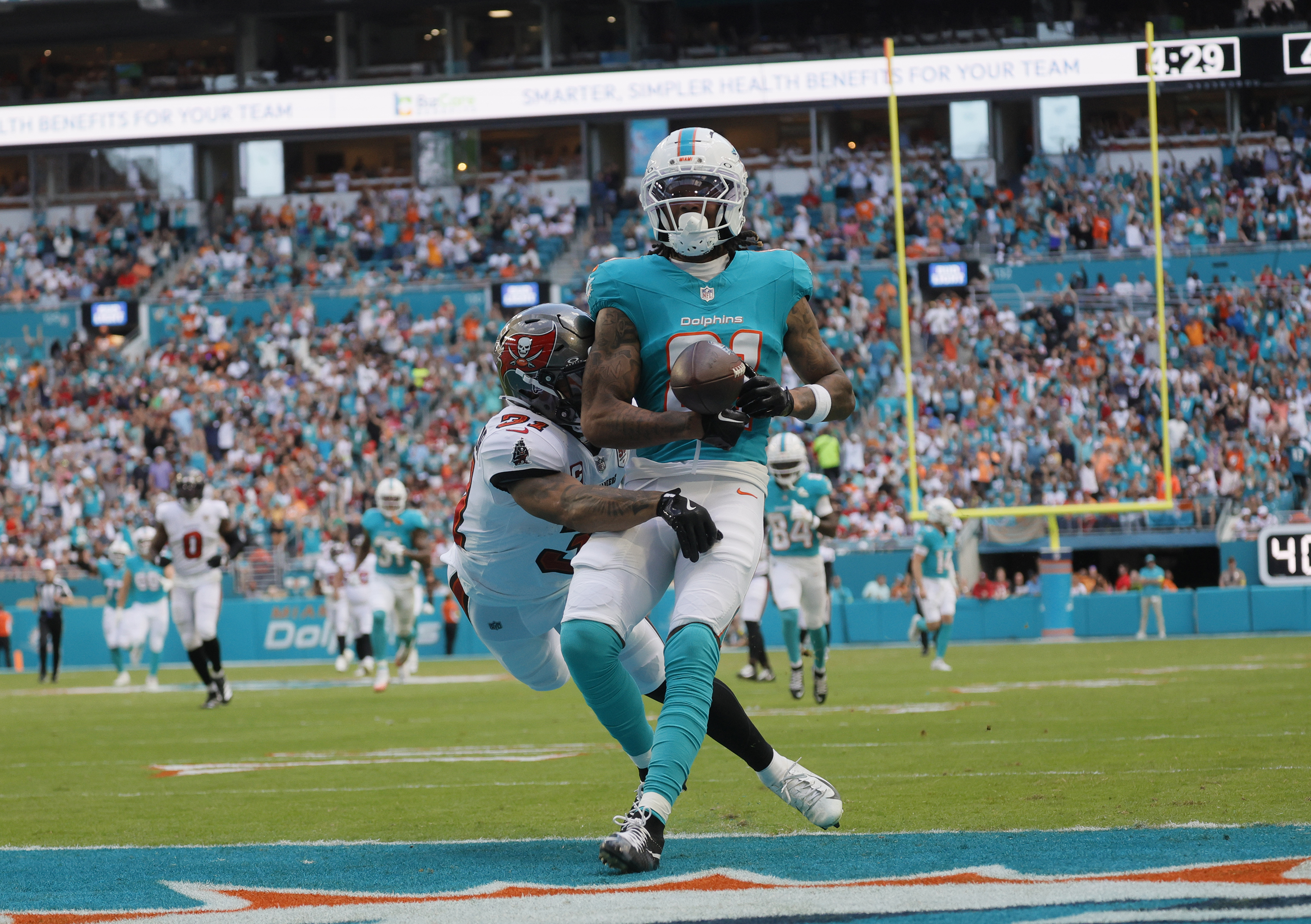Miami Dolphins wide receiver Theo Wease Jr. (81) runs in...