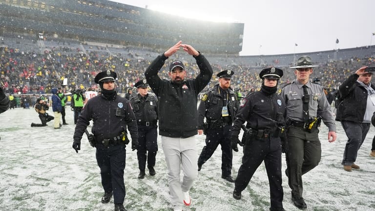 Ohio State Buckeyes head coach Ryan Day celebrates after the...
