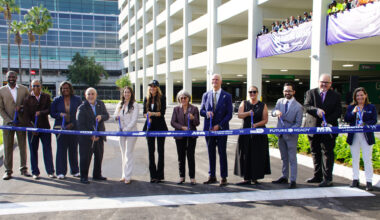 Miami-Dade County Mayor Daniella Levine Cava (center), Miami-Dade County Chief Operations Officer Jimmy Morales and County Commissioners Natalie Milian-Orbis and Danielle Cohen Higgins (left of center), MIA Director and CEO Ralph Cuti&eacute;, Lemartec Senior Vice President Maira Suarez, and Florida State Rep. Juan Carlos Porras (right of center), and other local and MIA officials cut the ribbon for the new Ibis Garage.