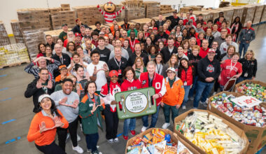 Ohio State and Miami worked together for a community service project today benefiting the North Texas Food Bank