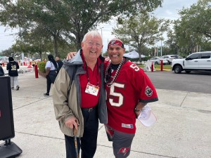 Greg D’Cruz with the voice of the Tampa Bay Buccaneers Gene Deckerhoff