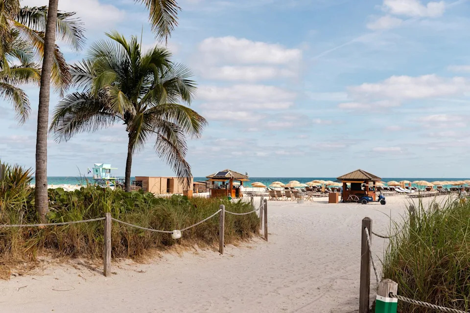 Adrian Rudd/Travel + Leisure A sand walkway to a Miami beach.