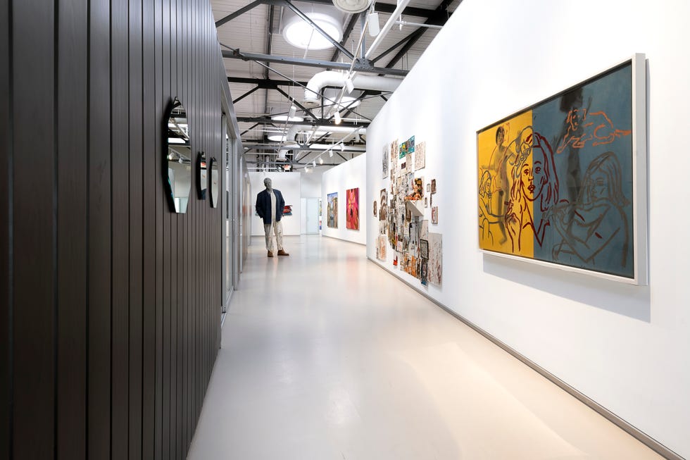 Art gallery featuring a corridor with various artworks. Art gallery featuring a corridor with various artworks.