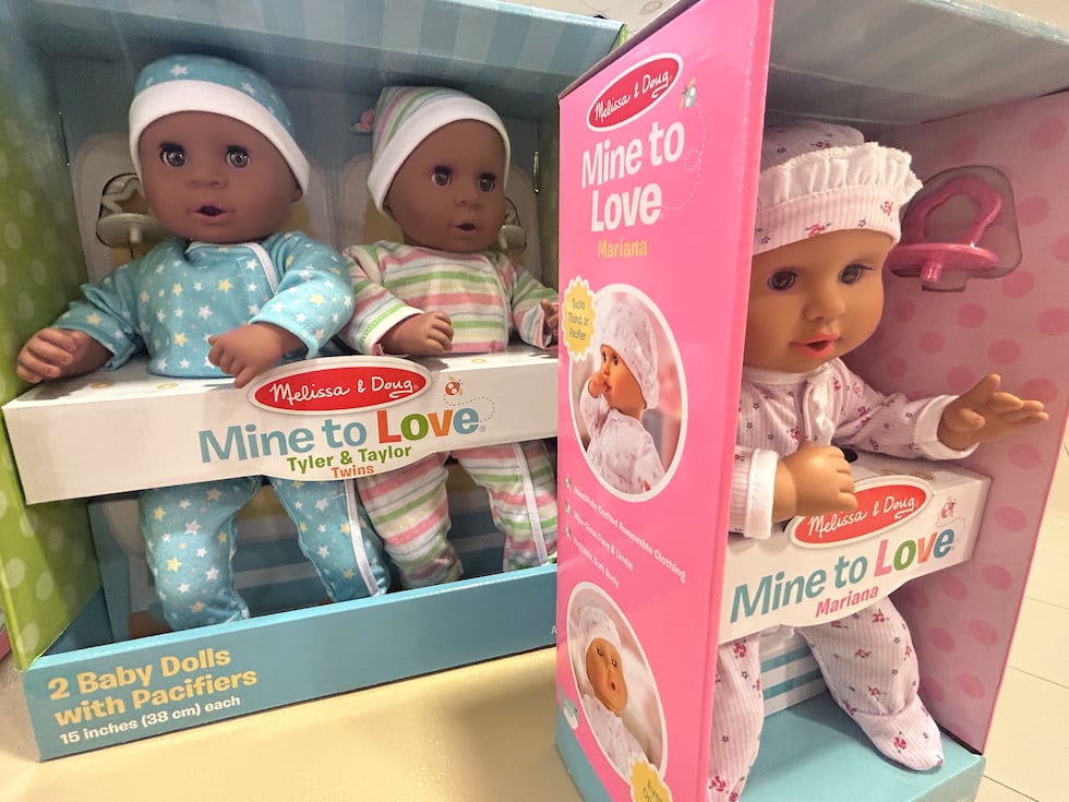 Toys like these baby dolls are starting to fill tables at the Christmas Connection warehouse.