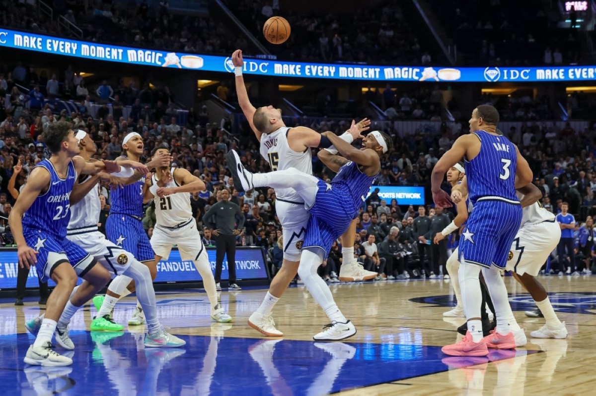 ORLANDO: Wendell Carter Jr. #34 of the Orlando Magic fouls Nikola Jokic #15 of the Denver Nuggets on a jump ball in the second half of the game at Kia Center in Orlando, Florida. – AFP