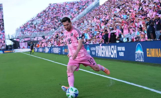 Inter Miami forward Lionel Messi (10) kicks a corner kicks during the first half of the MLS Cup final soccer match against the Vancouver Whitecaps Saturday, Dec. 6, 2025, in Fort Lauderdale, Fla. (AP Photo/Lynne Sladky)