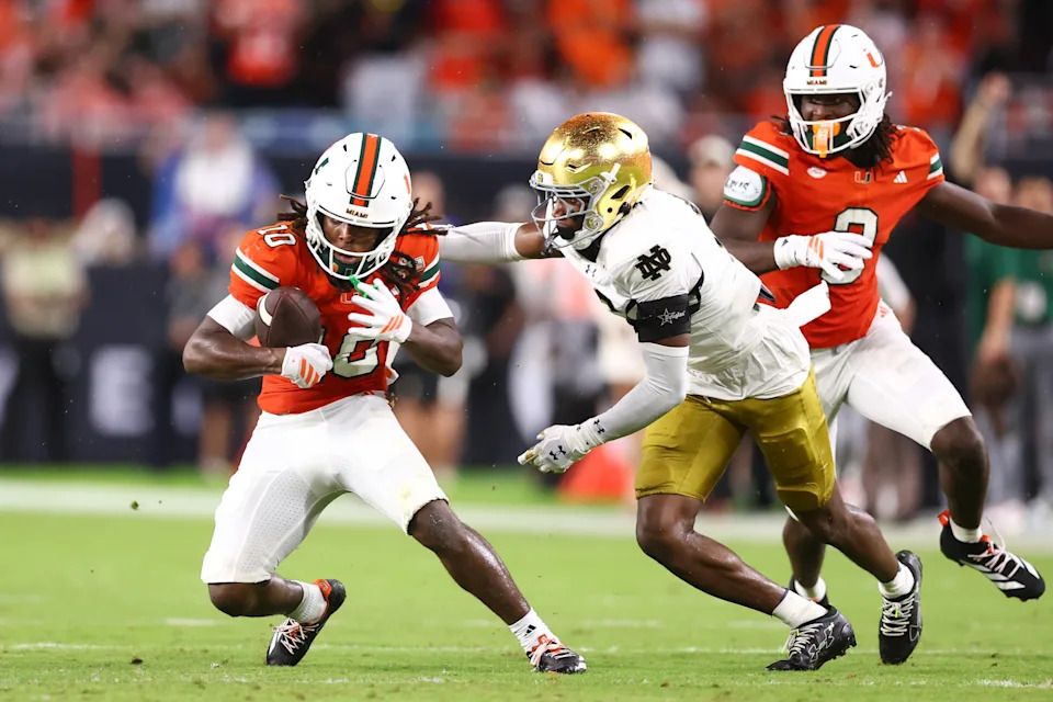 MIAMI GARDENS, FLORIDA - AUGUST 31: Malachi Toney #10 of the Miami Hurricanes carries the ball against the Notre Dame Fighting Irish during the first quarter of the game at Hard Rock Stadium on August 31, 2025 in Miami Gardens, Florida. (Photo by Megan Briggs/Getty Images)