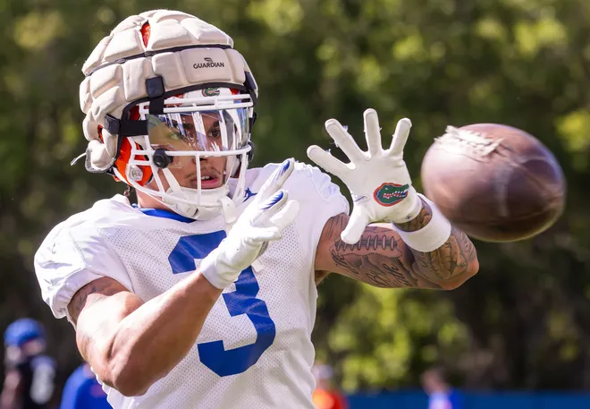 Florida Gators wide receiver Eugene Wilson III (3) hauls in a pass while taking balls from a throwing machine during University of Florida Gators’ Spring football practice at Sanders Practice Fields in Gainesville, FL on Thursday, March 28, 2024. [Doug Engle/Gainesville Sun]