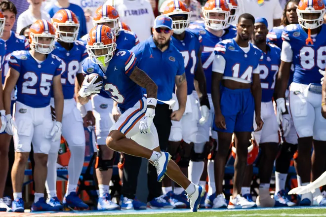 Aug 31, 2024; Gainesville, Florida, USA; Florida Gators wide receiver Eugene Wilson III (3) runs the ball for a first down against the Miami Hurricanes during the first half at Ben Hill Griffin Stadium. Mandatory Credit: Matt Pendleton-USA TODAY Sports