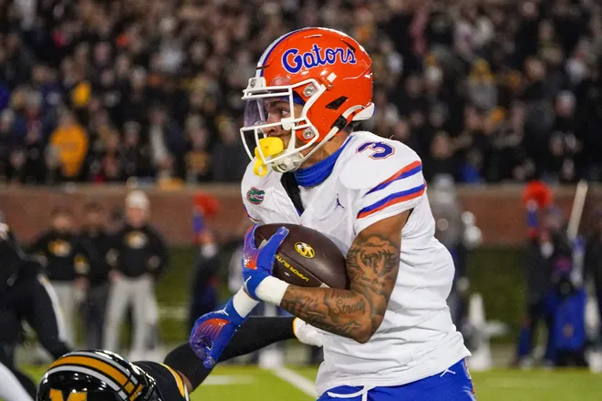 Nov 18, 2023; Columbia, Missouri, USA; Florida Gators wide receiver Eugene Wilson III (3) runs the ball against the Missouri Tigers during the first half at Faurot Field at Memorial Stadium. Mandatory Credit: Denny Medley-USA TODAY Sports