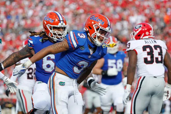 Oct 28, 2023; Jacksonville, Florida, USA; Florida Gators wide receiver Eugene Wilson III (3) celebrates his touchdown with offensive lineman Kingsley Eguakun (65) in the first half at EverBank Stadium. Mandatory Credit: Jeff Swinger-USA TODAY Sports