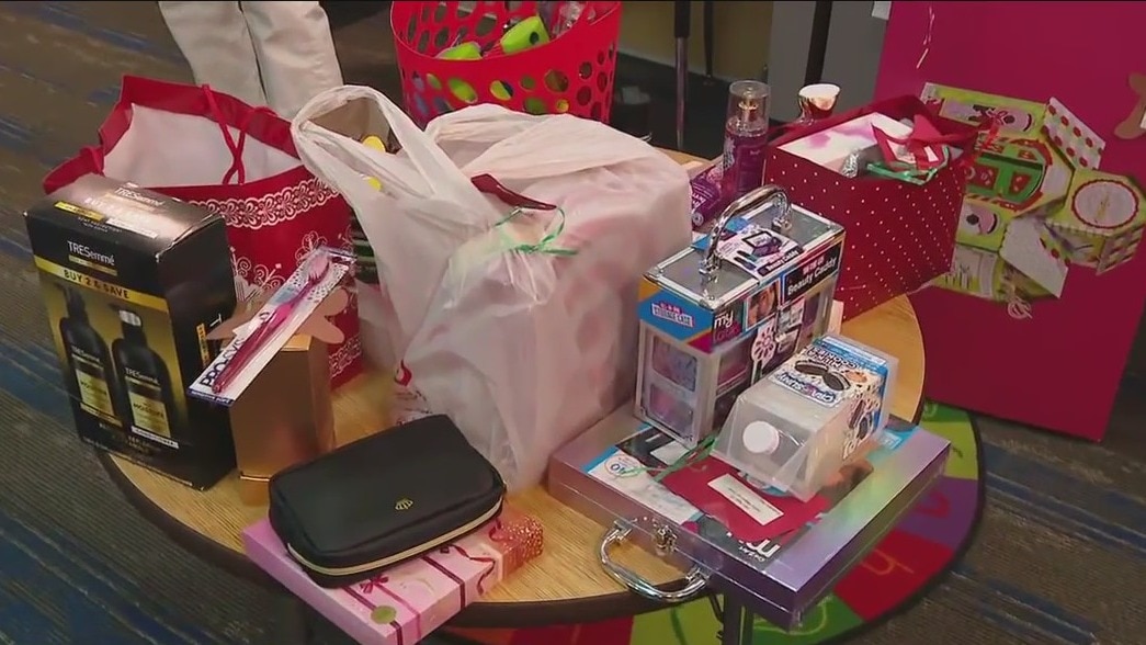 Volunteers packaging gifts for students