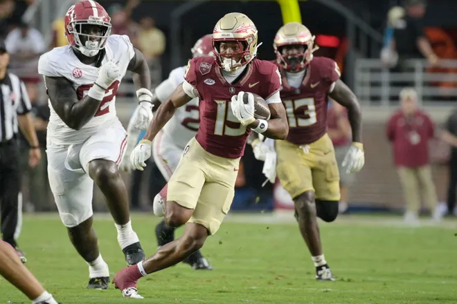 Aug 30, 2025; Tallahassee, Florida, USA; Florida State Seminoles wide receiver Micahi Danzy (19) runs with the ball against the Alabama Crimson Tide during the second half at Doak S. Campbell Stadium. Mandatory Credit: Melina Myers-Imagn Images