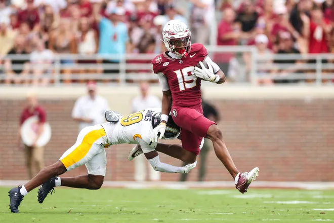 TALLAHASSEE, FLORIDA - SEPTEMBER 20: Micahi Danzy #19 of the Florida State Seminoles runs with the ball for a touchdown against DJ Barnes #19 of the Kent State Golden Flashes during the first half of a game at Doak S. Campbell Stadium on September 20, 2025 in Tallahassee, Florida. (Photo by James Gilbert/Getty Images)