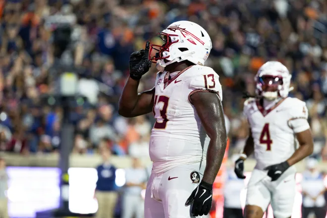 CHARLOTTESVILLE, VIRGINIA - SEPTEMBER 26: Randy Pittman Jr. #13 of the Florida State Seminoles celebrates a touchdown in the first half during a game against the Virginia Cavaliers at Scott Stadium on September 26, 2025 in Charlottesville, Virginia. (Photo by Ryan M. Kelly/Getty Images)