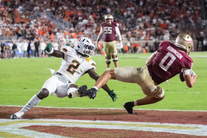 Florida State Seminoles wide receiver Duce Robinson (0) tries to catch the ball in the end zone. The Miami Hurricanes defeated the Florida State Seminoles 22-28 at Doak Campbell Stadium on Saturday, Oct. 4, 2025.
