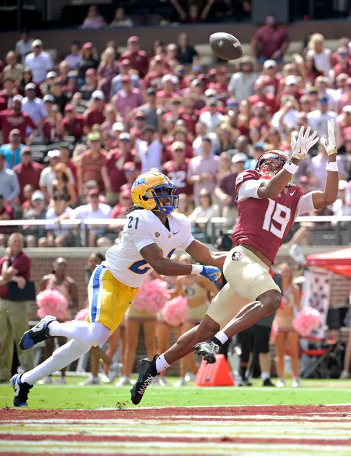 Florida State Seminoles wide receiver Micahi Danzy (19) catches a touchdown pass over Pittsburgh defensive back Shadarian Harrison (21) during the first half Oct. 11, 2025 at Doak S. Campbell Stadium in Tallahassee, Florida. Mandatory Credit: Melina Myers-Imagn Images