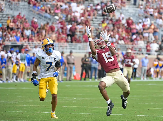 Oct 11, 2025; Tallahassee, Florida, USA; Florida State Seminoles wide receiver Micahi Danzy (19) scores a touchdown past Pittsburgh Panthers defensive back Javon McIntyre (7) in the fourth quarter at Doak S. Campbell Stadium. Mandatory Credit: Melina Myers-Imagn Images