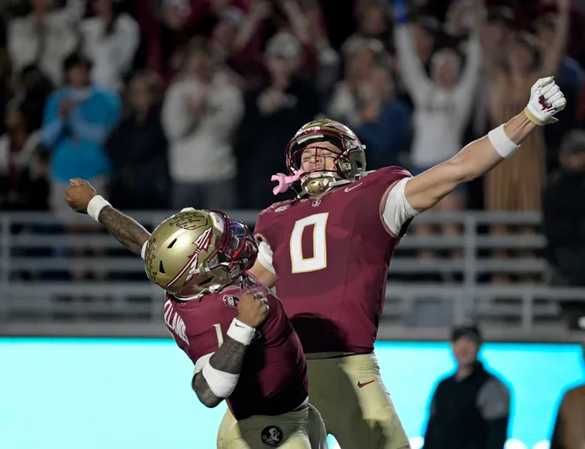 Nov 1, 2025; Tallahassee, Florida, USA; Florida State Seminoles quarterback Tommy Castellanos (1) celebrates a touchdown with wide receiver Duce Robinson (0) during the second half against the Wake Forest Demon Deacons at Doak S. Campbell Stadium. Mandatory Credit: Melina Myers-Imagn Images