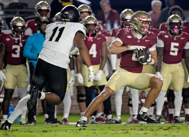 Nov 1, 2025; Tallahassee, Florida, USA; Florida State Seminoles wide receiver Duce Robinson (0) runs with the ball during the first half against the Wake Forest Demon Deacons at Doak S. Campbell Stadium. Mandatory Credit: Melina Myers-Imagn Images