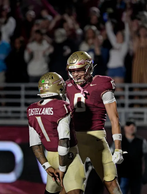 Nov 1, 2025; Tallahassee, Florida, USA; Florida State Seminoles quarterback Tommy Castellanos (1) celebrates a touchdown with wide receiver Duce Robinson (0) during the second half against the Wake Forest Demon Deacons at Doak S. Campbell Stadium. Mandatory Credit: Melina Myers-Imagn Images