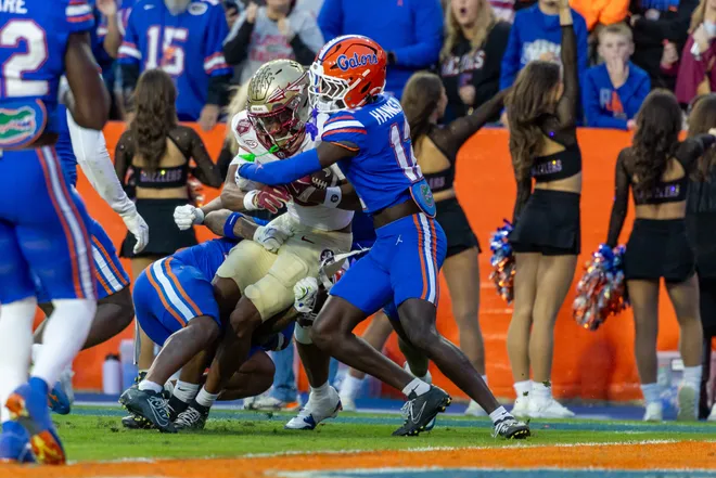 Nov 29, 2025; Gainesville, Florida, USA; Florida State Seminoles wide receiver Micahi Danzy (19) pushes in for a touchdown during the second quarter against the Florida Gators at Ben Hill Griffin Stadium. Mandatory Credit: Bob Kupbens-Imagn Images