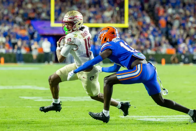 Nov 29, 2025; Gainesville, Florida, USA; Florida State Seminoles wide receiver Micahi Danzy (19) turns the corner during the second quarter against the Florida Gators at Ben Hill Griffin Stadium. Mandatory Credit: Bob Kupbens-Imagn Images