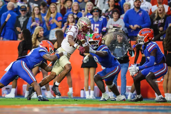 GAINESVILLE, FLORIDA - NOVEMBER 29: Micahi Danzy #19 of the Florida State Seminoles scores a touchdown during the first half of a game against the Florida Gators at Ben Hill Griffin Stadium on November 29, 2025 in Gainesville, Florida. (Photo by James Gilbert/Getty Images)
