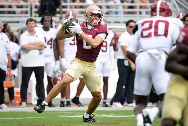 Aug 30, 2025; Tallahassee, Florida, USA; Florida State Seminoles wide receiver Duce Robinson (0) makes a catch against the Alabama Crimson Tide during the first half at Doak S. Campbell Stadium. Mandatory Credit: Melina Myers-Imagn Images