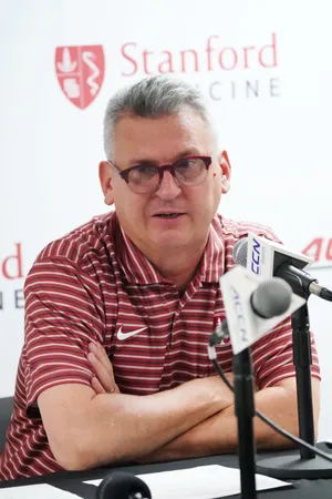 Dec 7, 2025; Stanford, California, USA; Stanford Cardinal head coach Kyle Smith addresses the media at the post-game press conference after the game against the UNLV Runnin' Rebels at Maples Pavilion. Mandatory Credit: David Gonzales-Imagn Images