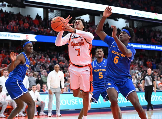 Dec 13, 2025; Syracuse, New York, USA; Syracuse Orange forward Kiyan Anthony (7) collides with Hofstra Pride forward Victory Onuetu (6) on a shot in the second half at the JMA Wireless Dome. Mandatory Credit: Mark Konezny-Imagn Images