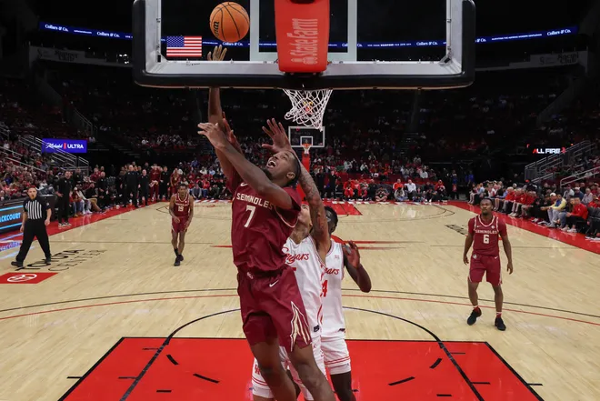 HOUSTON, TEXAS - DECEMBER 06: Chauncey Wiggins #7 of the Florida State Seminoles goes up for a lay up in the first half against the Houston Cougars at Toyota Center on December 06, 2025 in Houston, Texas. (Photo by Tim Warner/Getty Images)