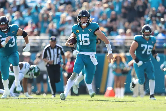 Dec 14, 2025; Jacksonville, Florida, USA; Jacksonville Jaguars quarterback Trevor Lawrence (16) runs the ball during the second quarter against the New York Jets at EverBank Stadium. Mandatory Credit: Morgan Tencza-Imagn Images