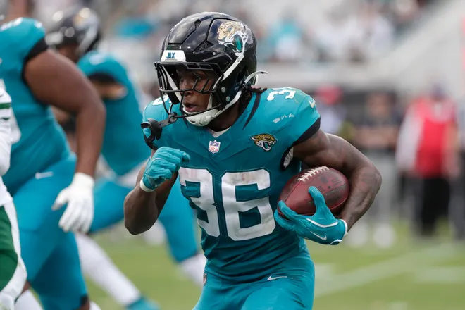 Dec 14, 2025; Jacksonville, Florida, USA; Jacksonville Jaguars running back Lequint Allen Jr. (36) carries the ball during the fourth quarter against the New York Jets at EverBank Stadium. Mandatory Credit: Travis Register-Imagn Images