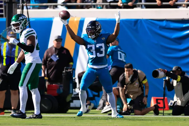 Jacksonville Jaguars running back Bhayshul Tuten (33) scores a rushing touchdown during the second quarter of an NFL football matchup at EverBank Stadium, Sunday, Dec. 14, 2025, in Jacksonville, Fla. [Corey Perrine/Florida Times-Union]