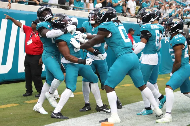 Dec 14, 2025; Jacksonville, Florida, USA; Jacksonville Jaguars players react after linebacker Ventrell Miller (51) intercepted the ball against the New York Jets during the fourth quarter at EverBank Stadium. Mandatory Credit: Morgan Tencza-Imagn Images